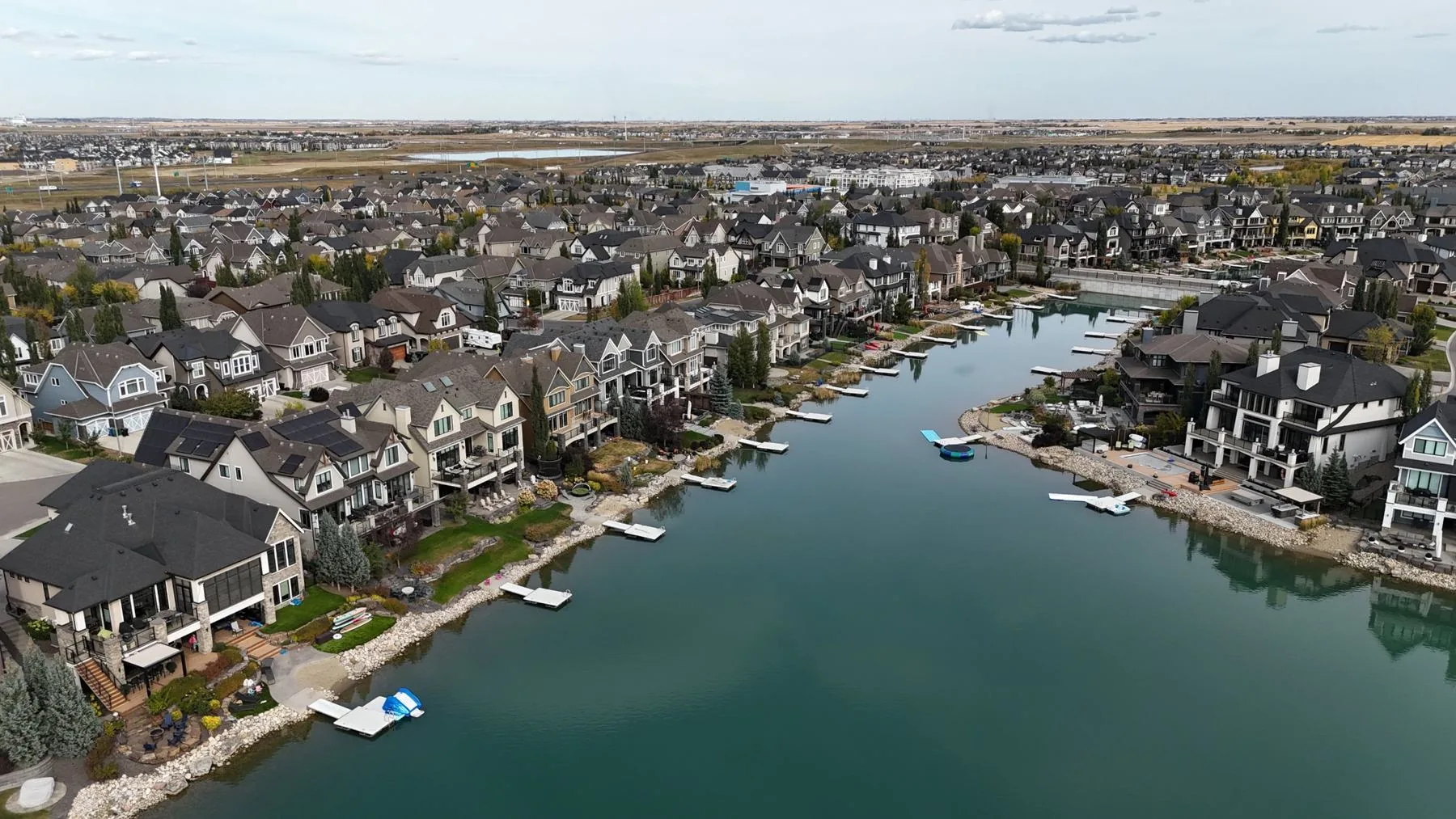 Drone photo of lake-front homes and docks along a Mahogany lake channel